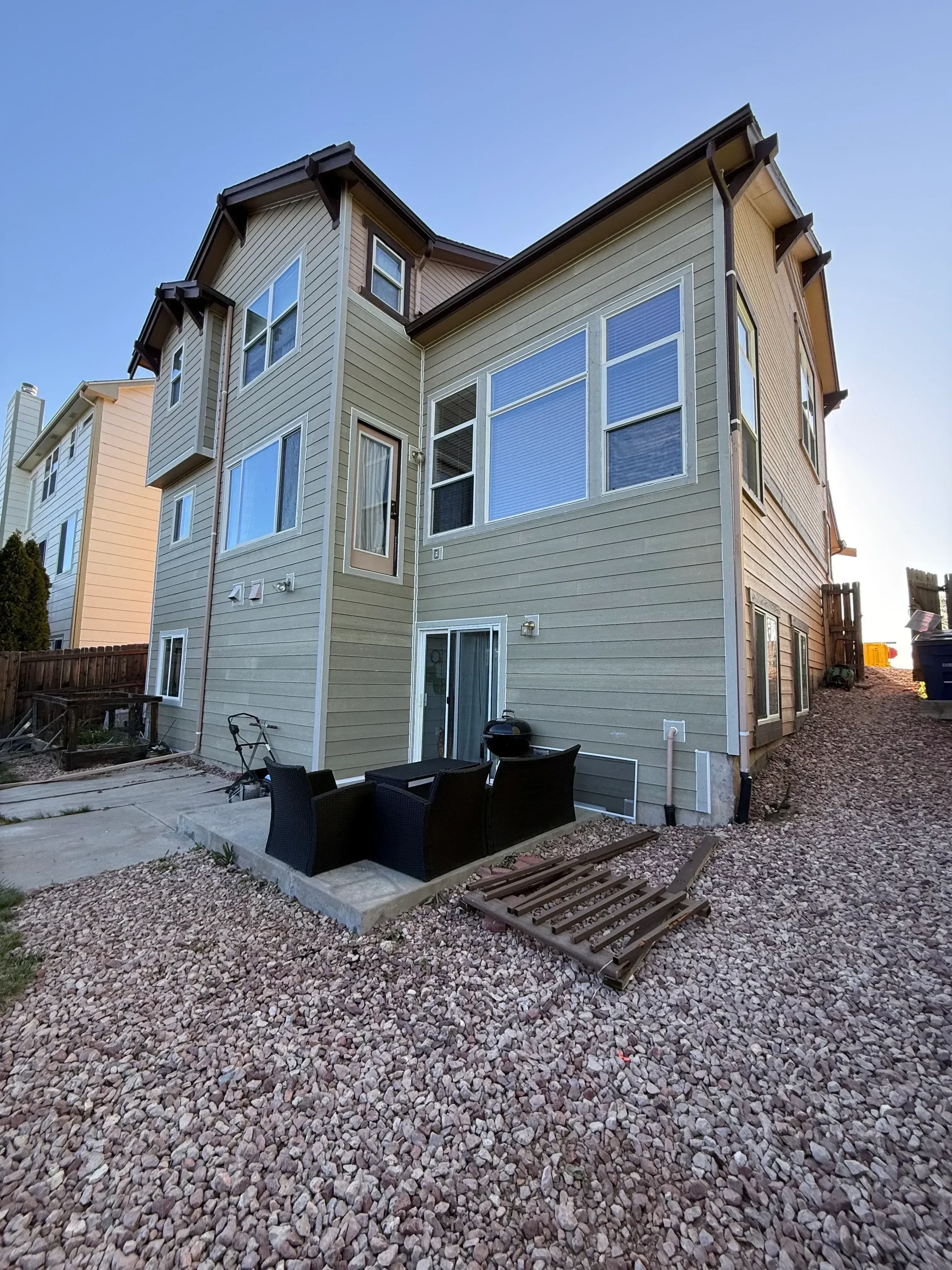 Metal siding, replacement windows, and standing seam metal roof on residential home